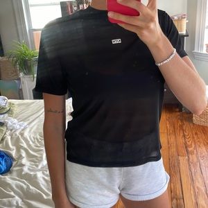 Women’s black top. Kith. Hardly worn, great condition. Size XS